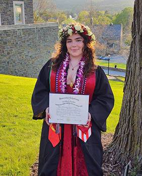Maria Vieira's graduation photo with diploma