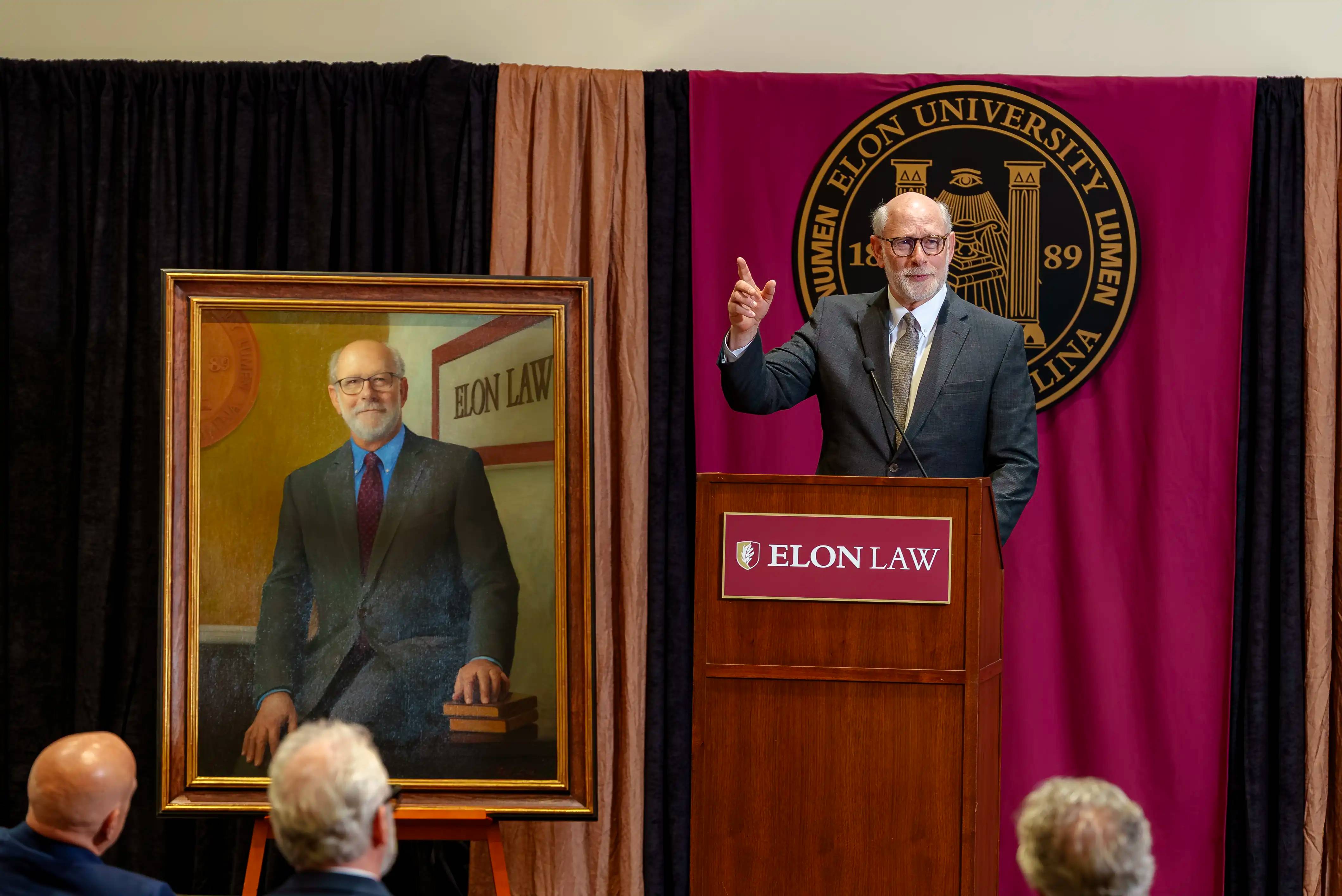 Elon Law colleagues gather on May 12, 2026 to unveil a portrait by Laurel Boeck in the Elon Law Library. (Photo credit: Ethan Wu / Elon University)