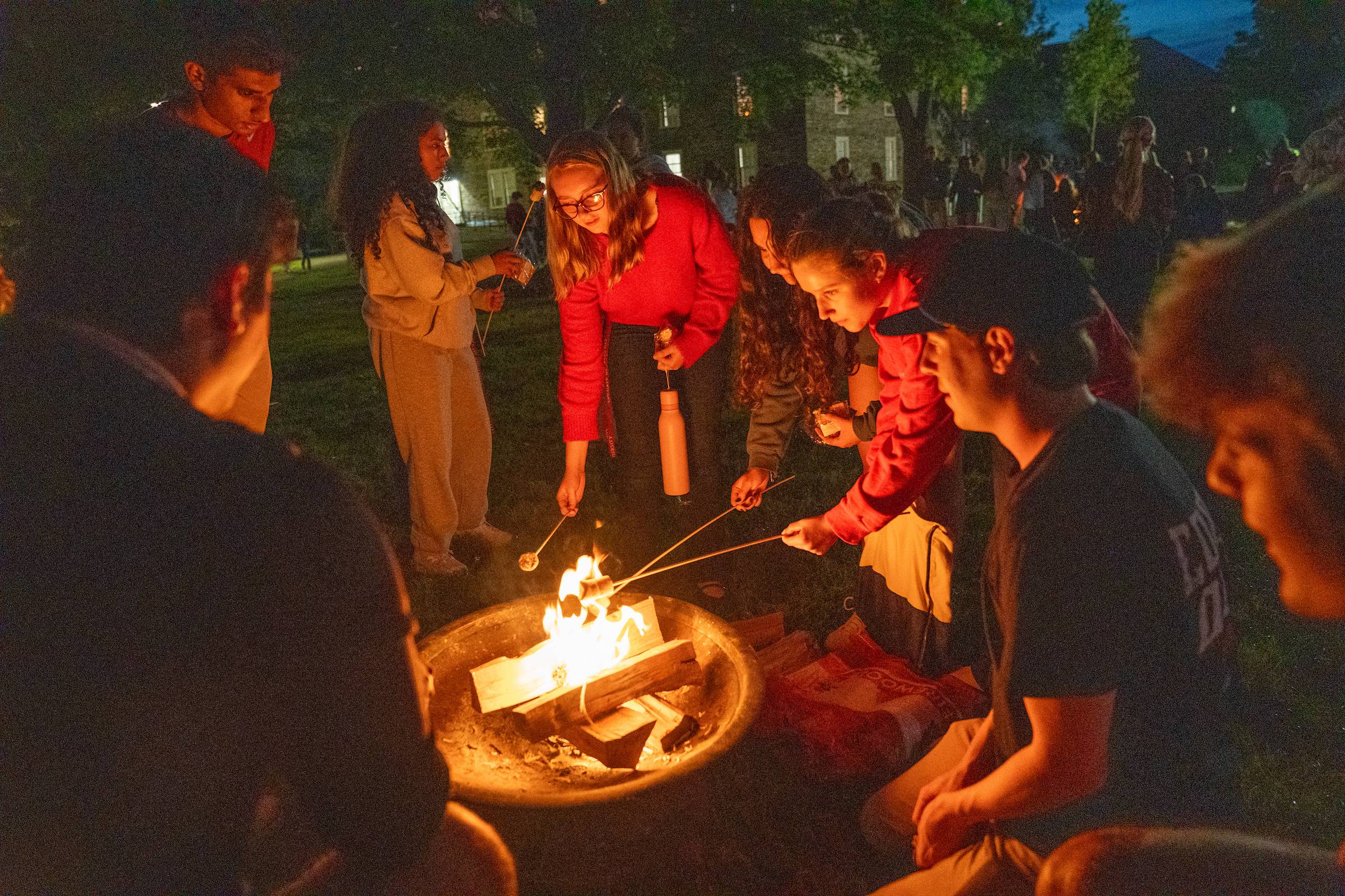 Students gather to make s’mores on the academic quad.