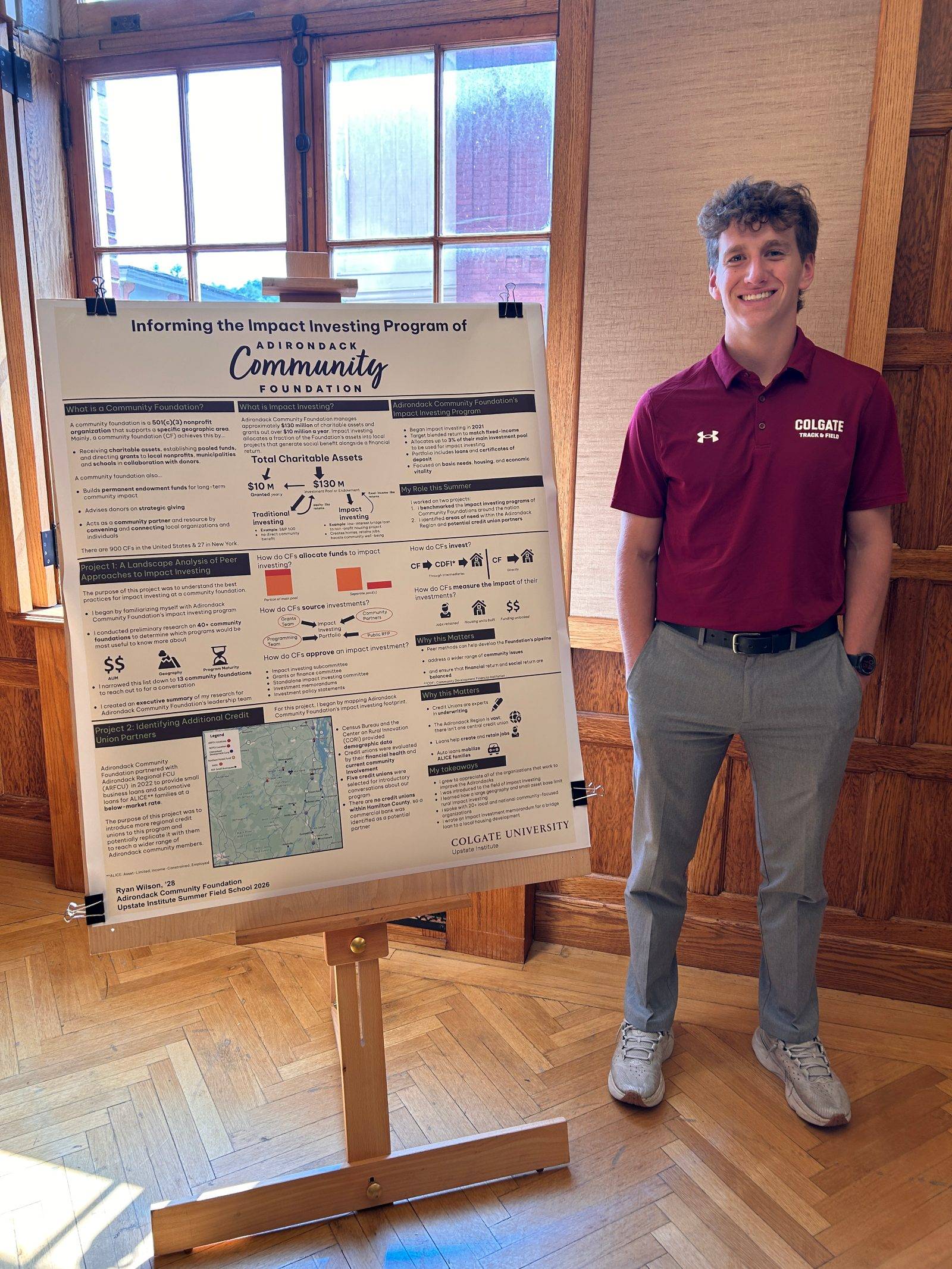 Ryan Wilson '28 with his poster about his summer research with the Adirondack Community Foundation.
