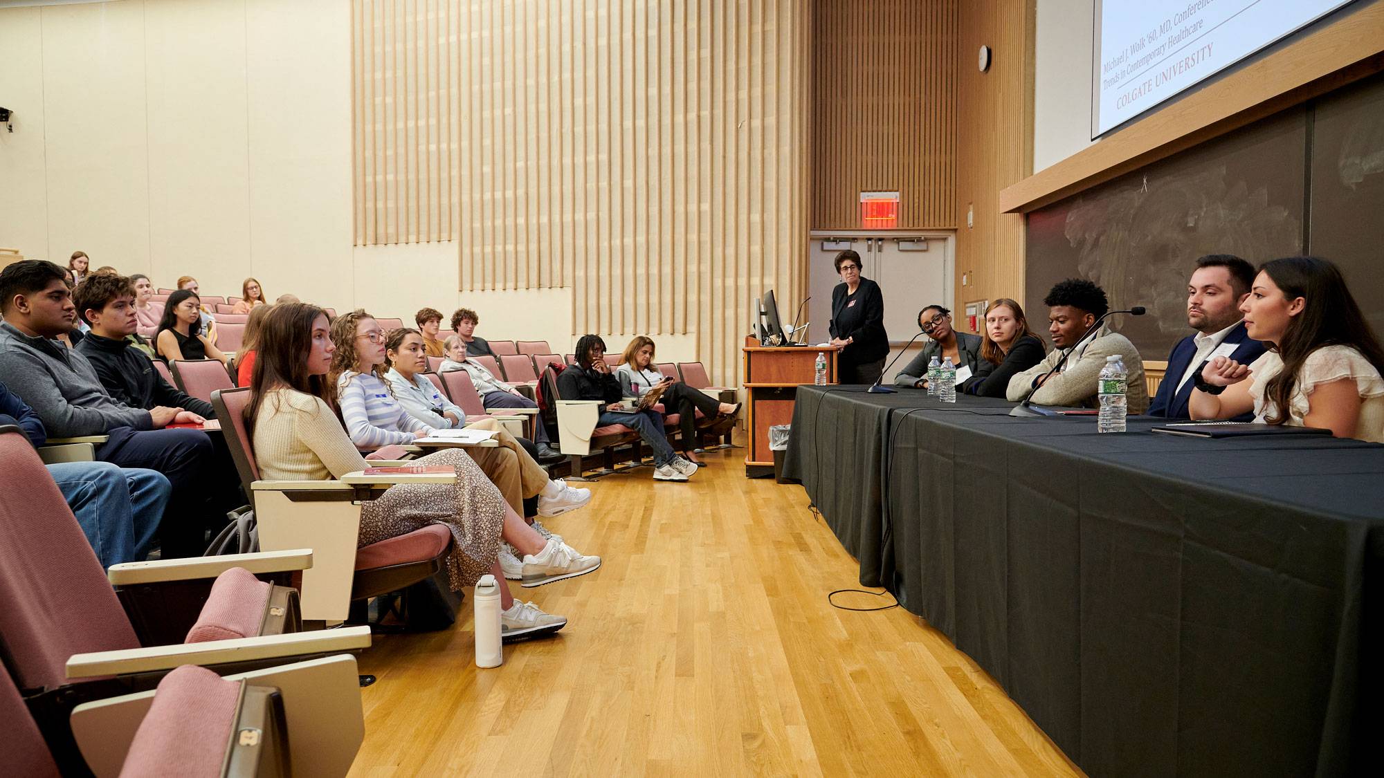 Students and panelists at conference session