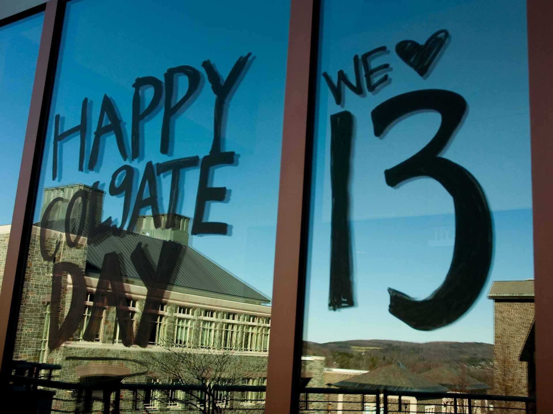 Window painted with "Happy Colgate Day" and "We Love 13"