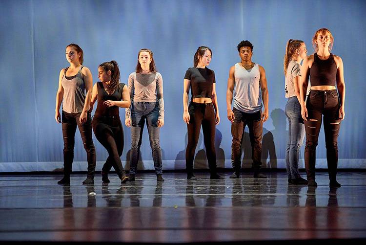 Student dancers and actors on stage