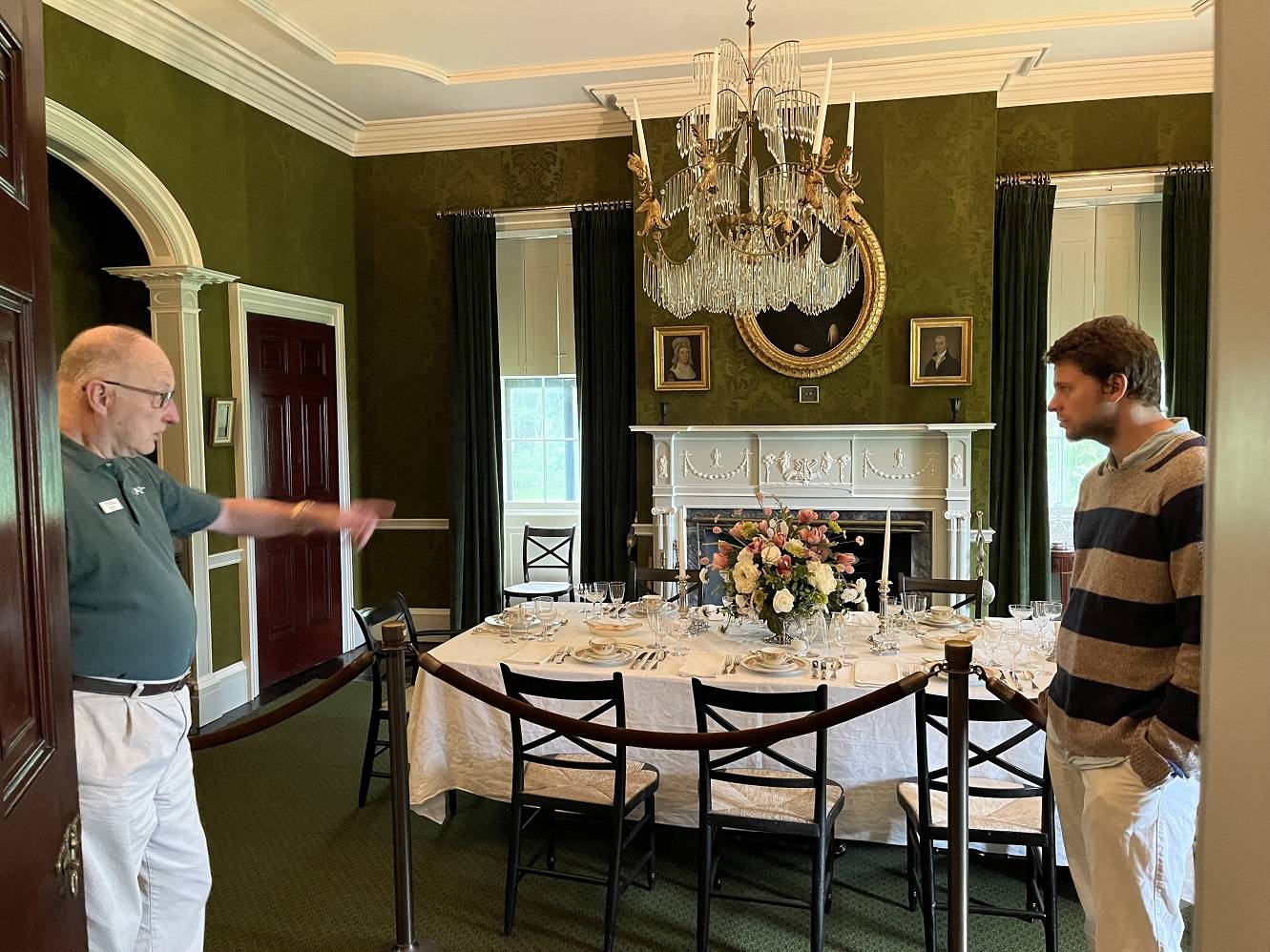 Charlie Citron '24 stands in a dining room at the Lorenzo State Historic Site with Charlie Albee