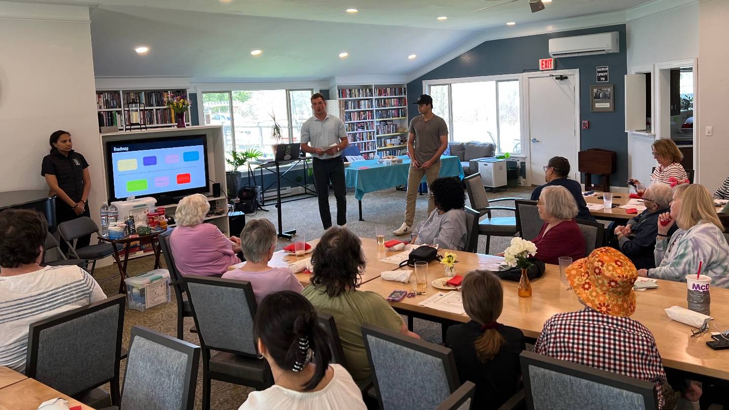 ENST Students Giving Presentation at Madison Lane Apartments