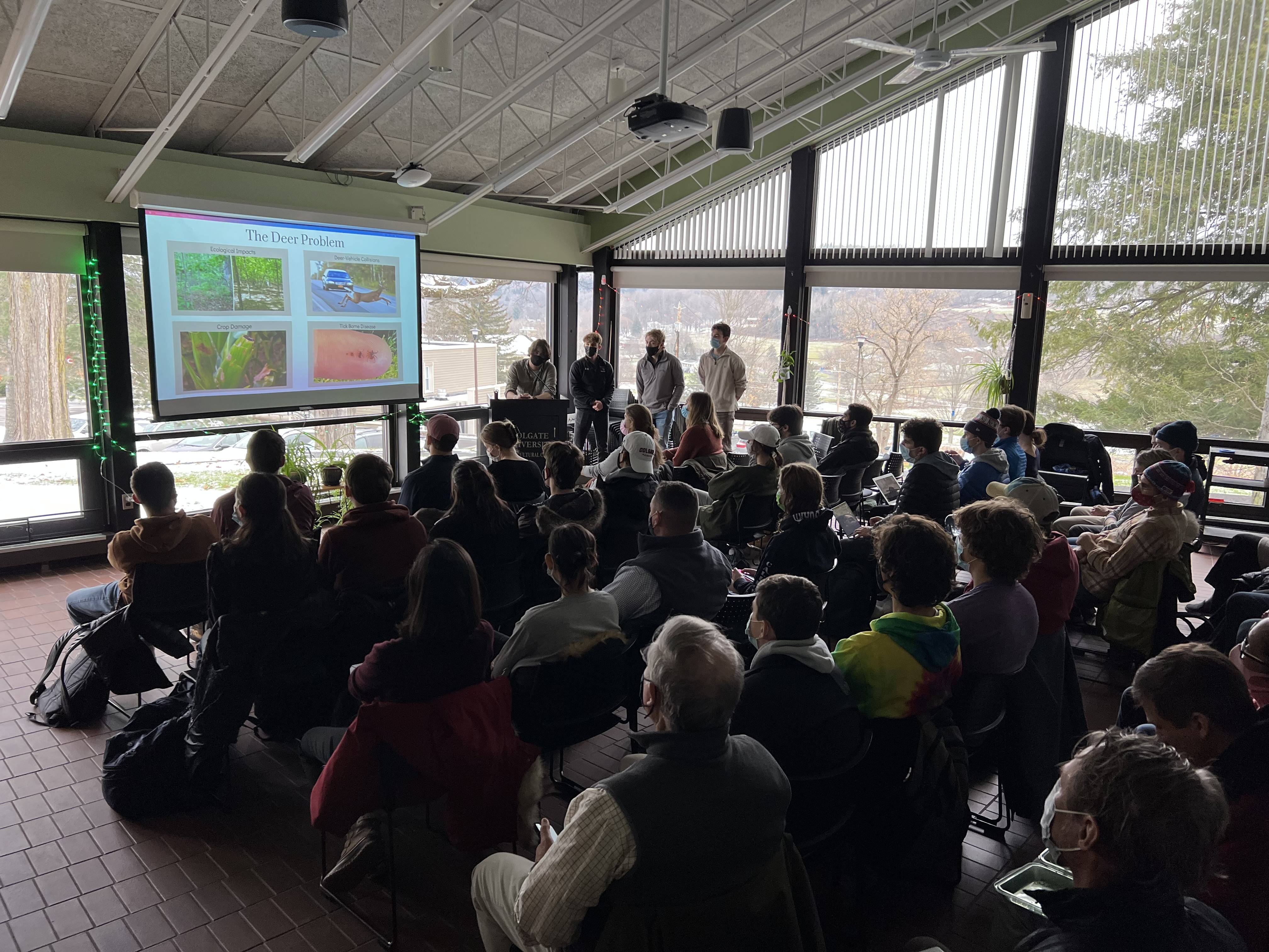 Students in ENST 389 present the results of their research on deer overabundance in December 2021.