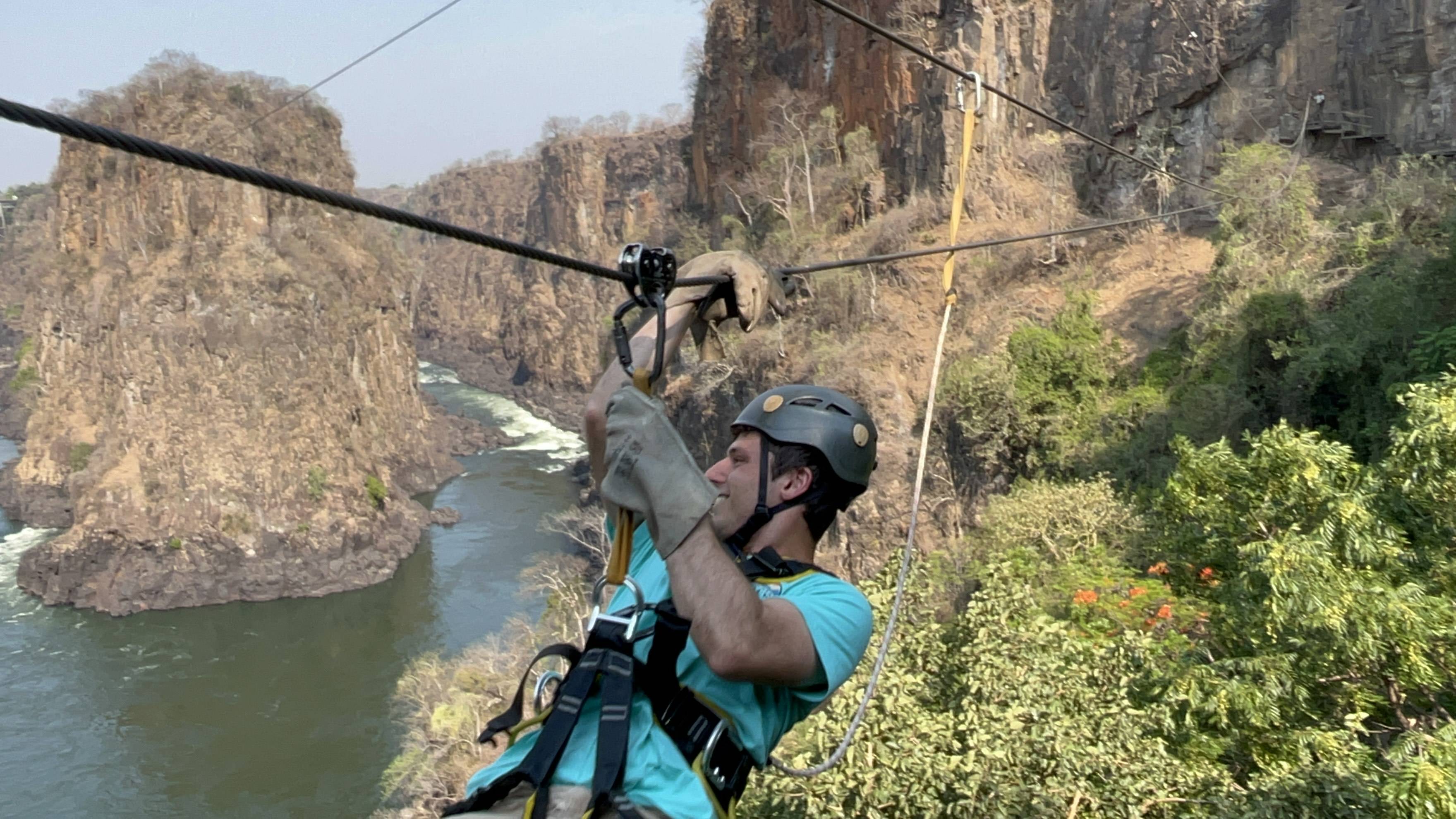 Joseph Berberich '24 on a zipline across a gorge at Victoria Falls, Botswana.