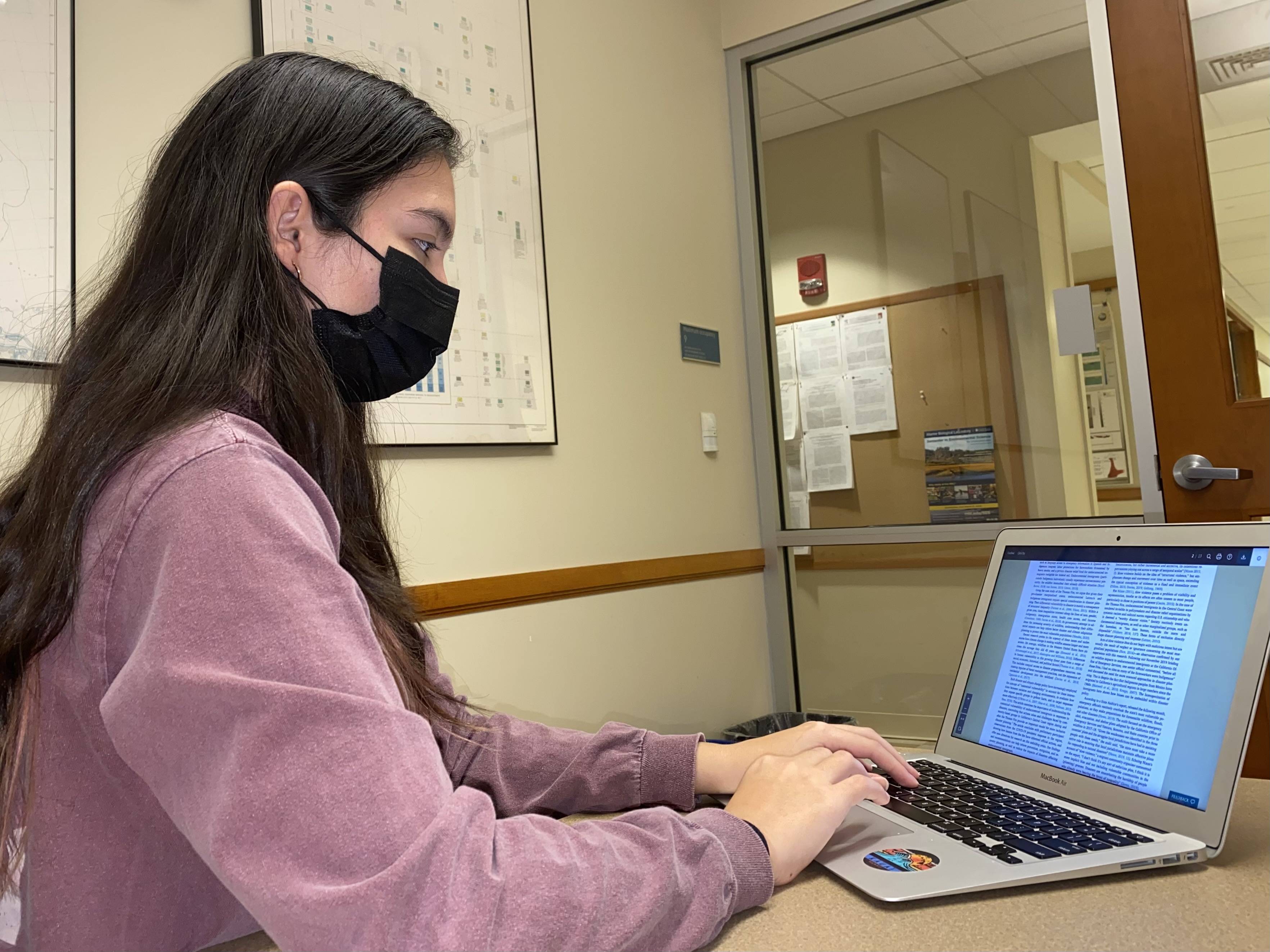 Keegan Kessler ’23 working at a laptop for NASA DEVELOP program.