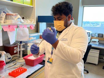 Labib Mamun ’24 working in his lab on campus