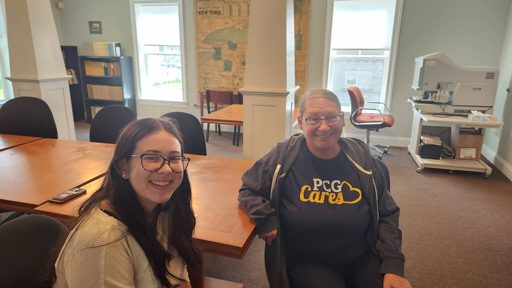 Sophia Lopez sits with Vivian at the Chenango County Historical Society