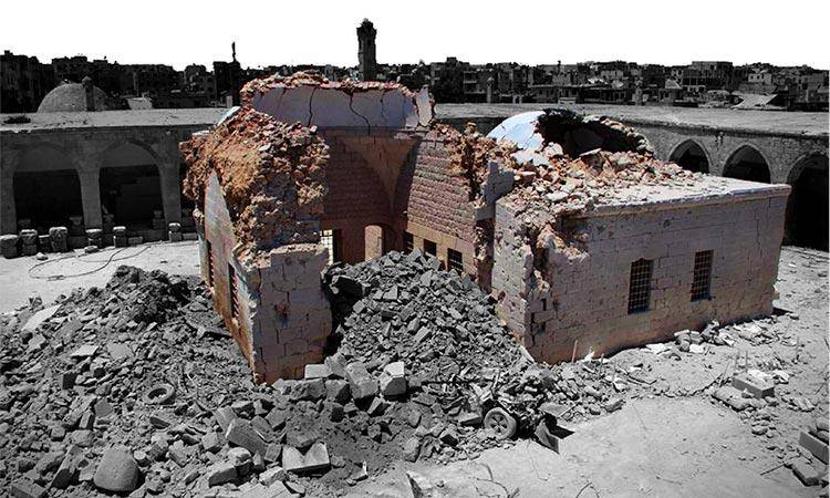 A building partially reduced to rubble 