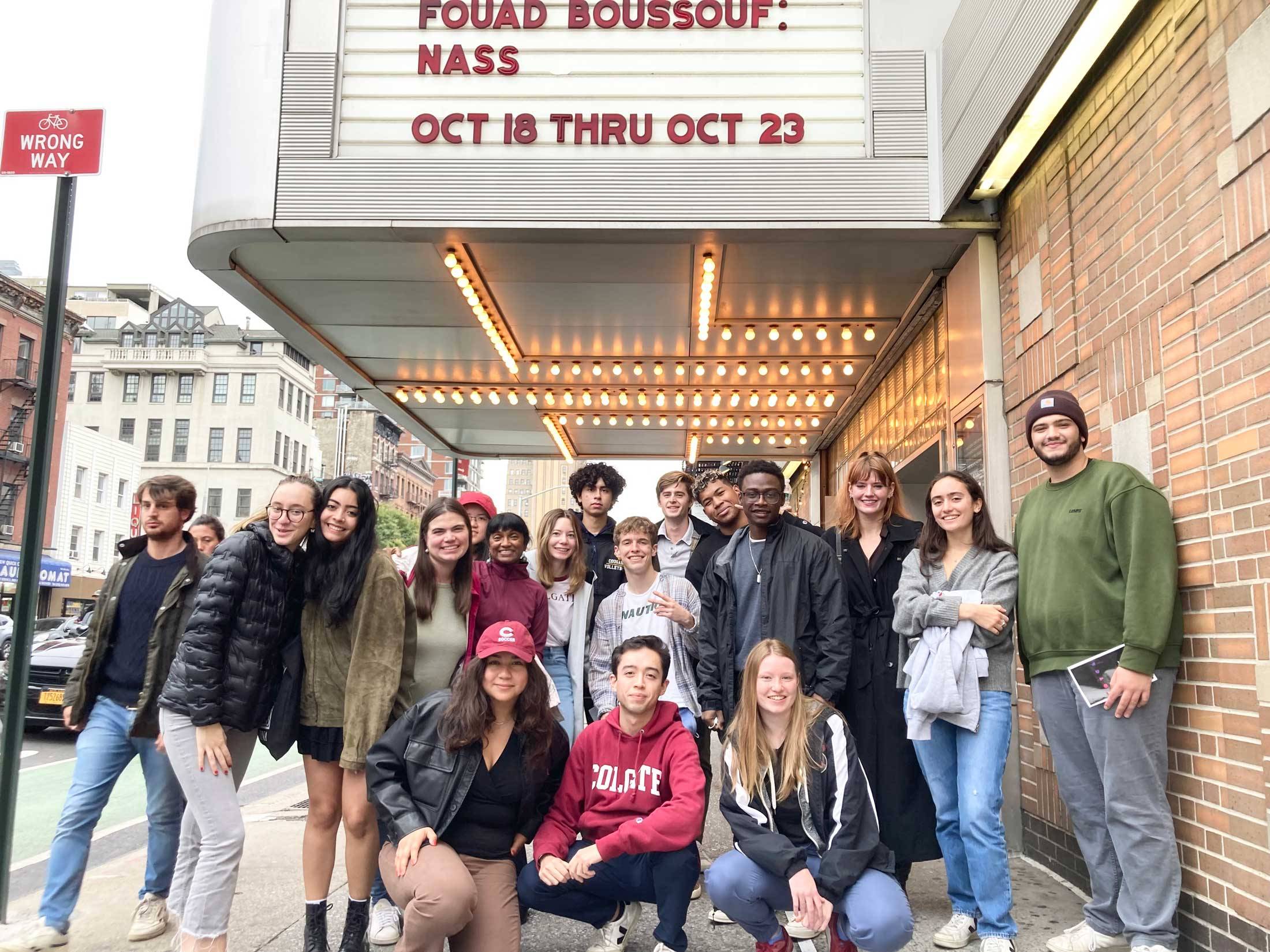 Students in front of theater marquee