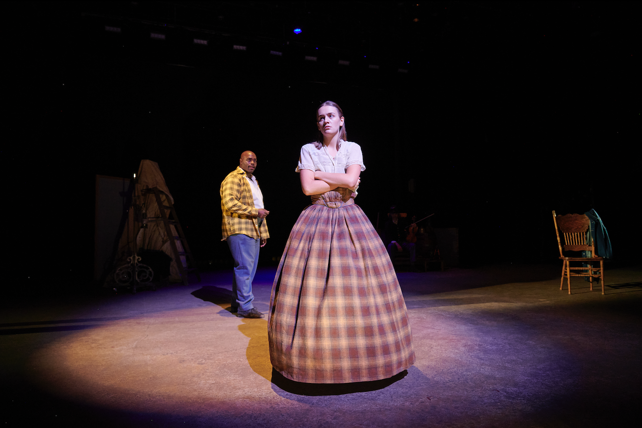 Characters of Toliver & Wakeman on stage.