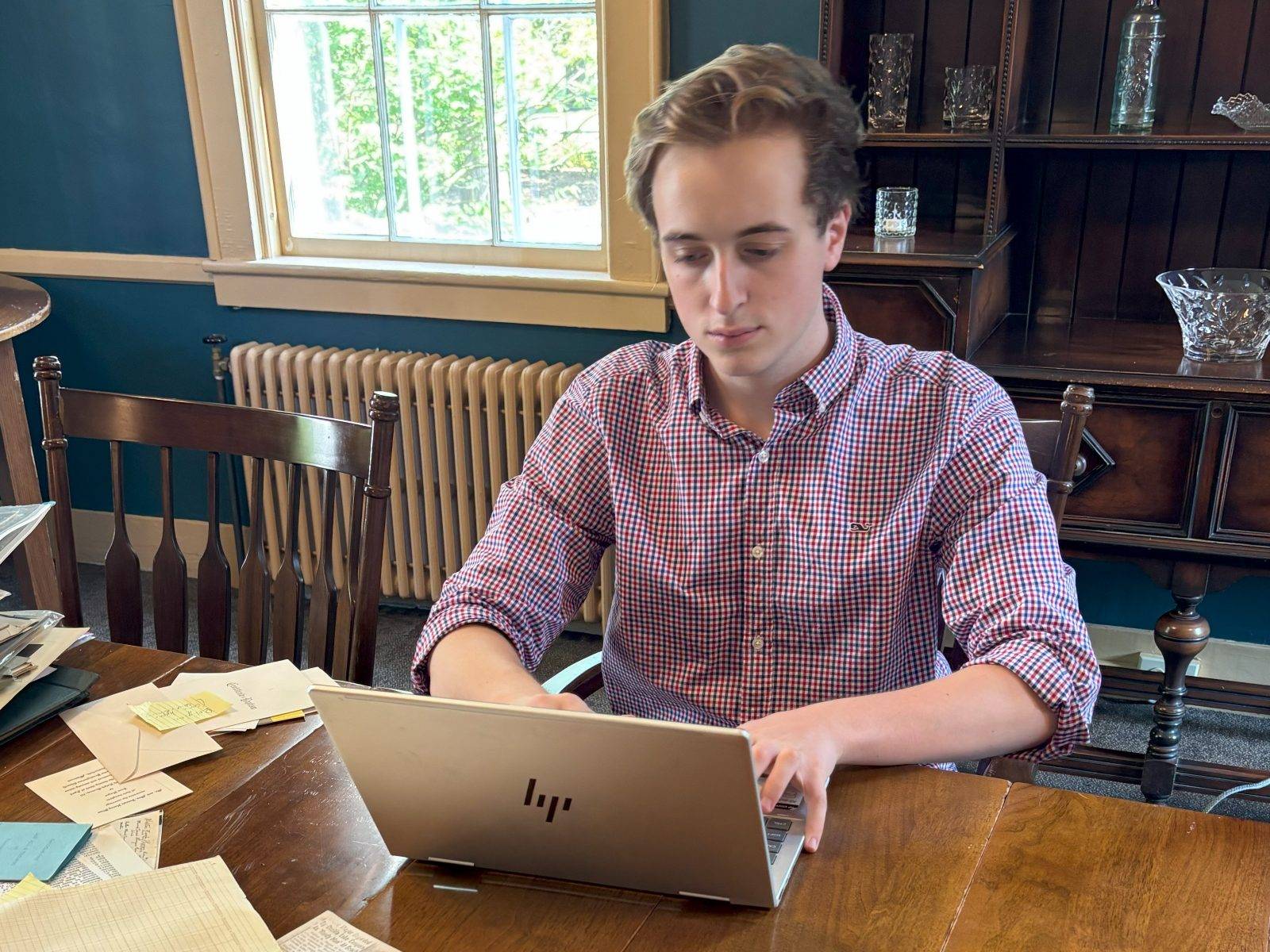 Jack Schaeffer ’26 works on an oral history project at the Oneida Community Mansion House as part of the Summer Field School.