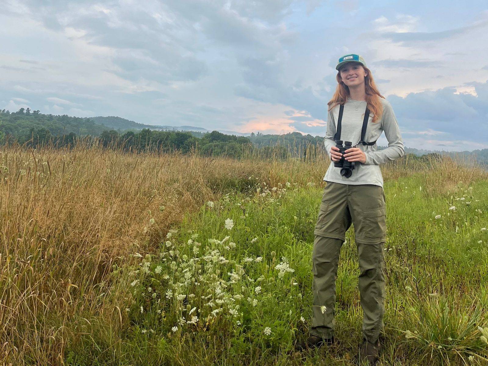 Naomi Valentine ’27 works in a field for the The Bobolink Project as part of the 2025 Upstate Institute Summer Field School.