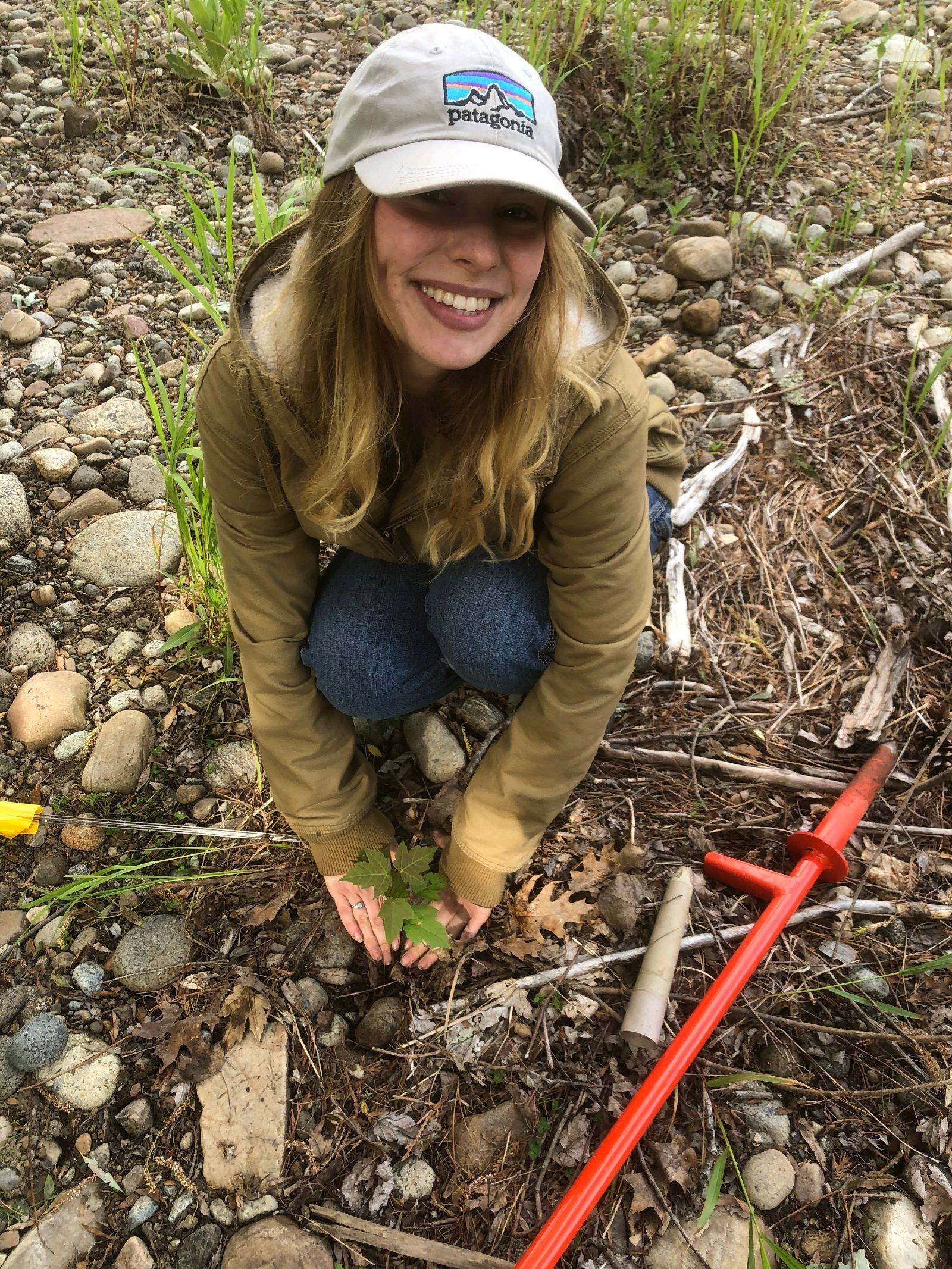 Sophie Sujo ’27 works in a field as part of her Summer Field School Fellowship with the Ausable Freshwater Center.