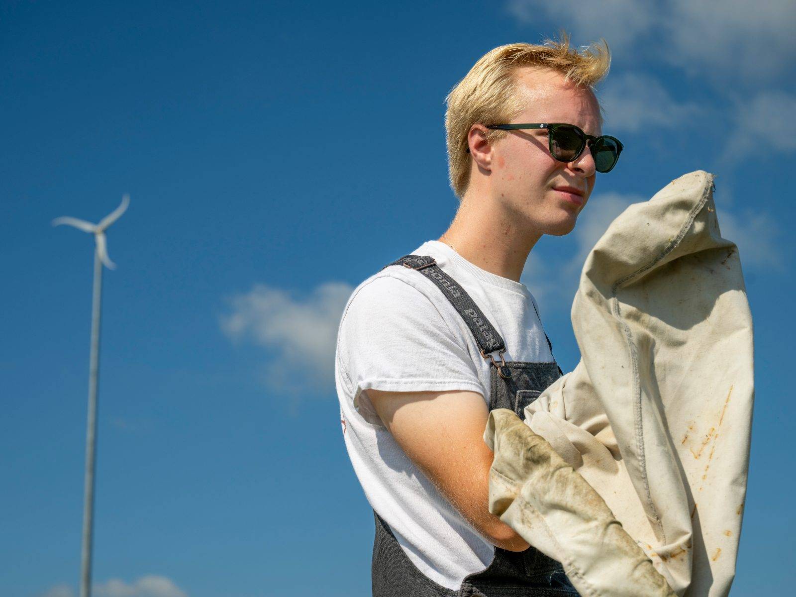 Upstate Institute Summer Field School Fellow Zachary O’Donnell ’27 sweeps an alfalfa field at a farm in Morrisville this summer as part of a research project working with the Cornell Cooperative Extension Central New York Dairy, Livestock, and Field Crops Team. 