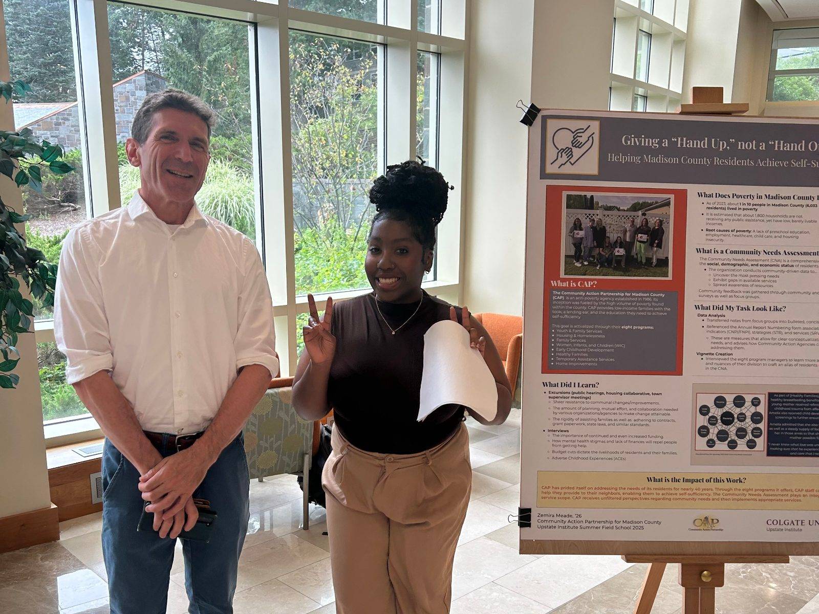 Zemira Meade ’26 presents her poster describing her work with the Community Action Partnership for Madison County as part of the Summer Field School.