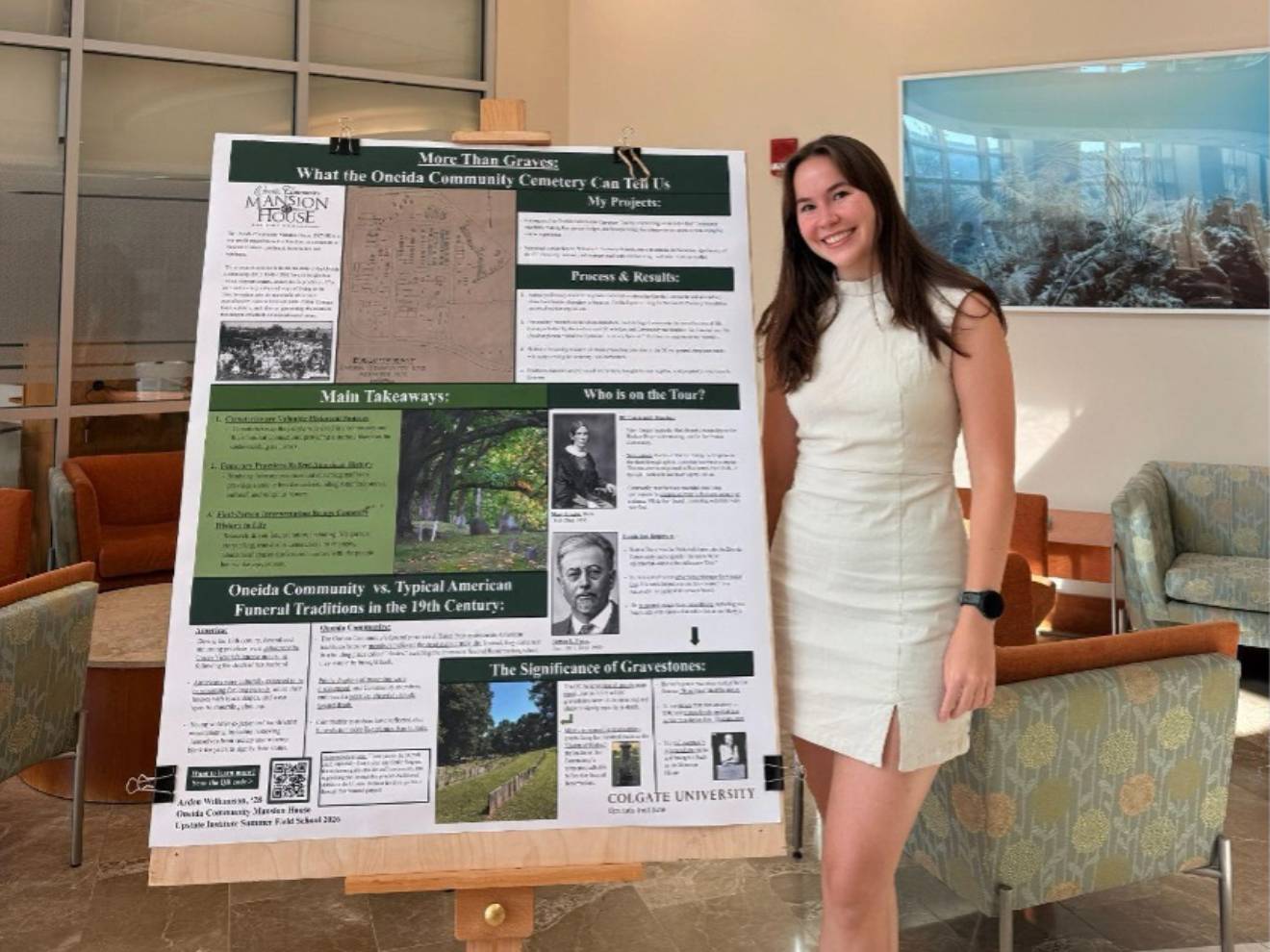 Arden Williamson ’28 worked with the Oneida Community Mansion House this summer helping to reimagine the Oneida Community Mansion House Cemetery Tour and stands with her poster during a poster session on campus in July.
