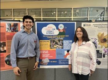 Gabriel Villamil stands next to Tara Truett 