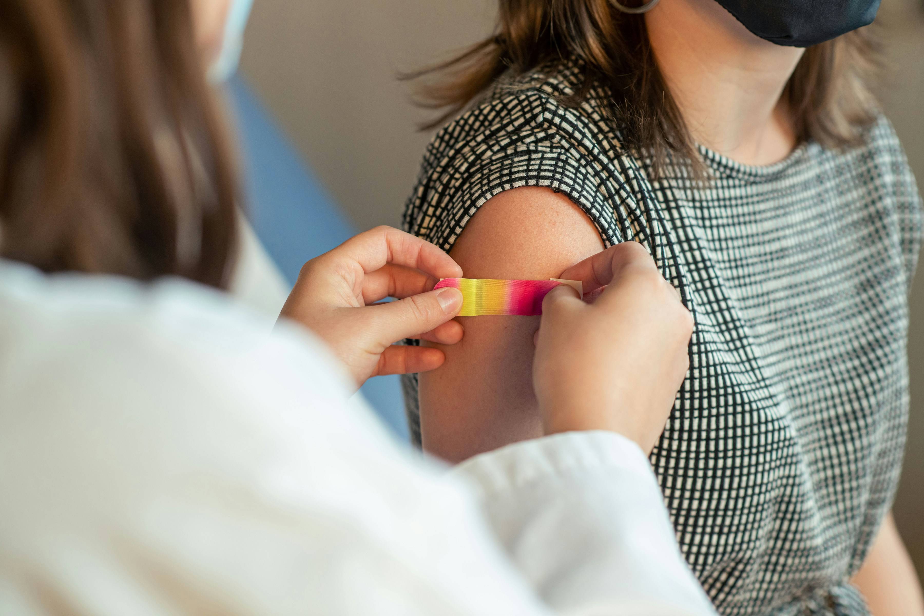 Bandage being applied after vaccination.