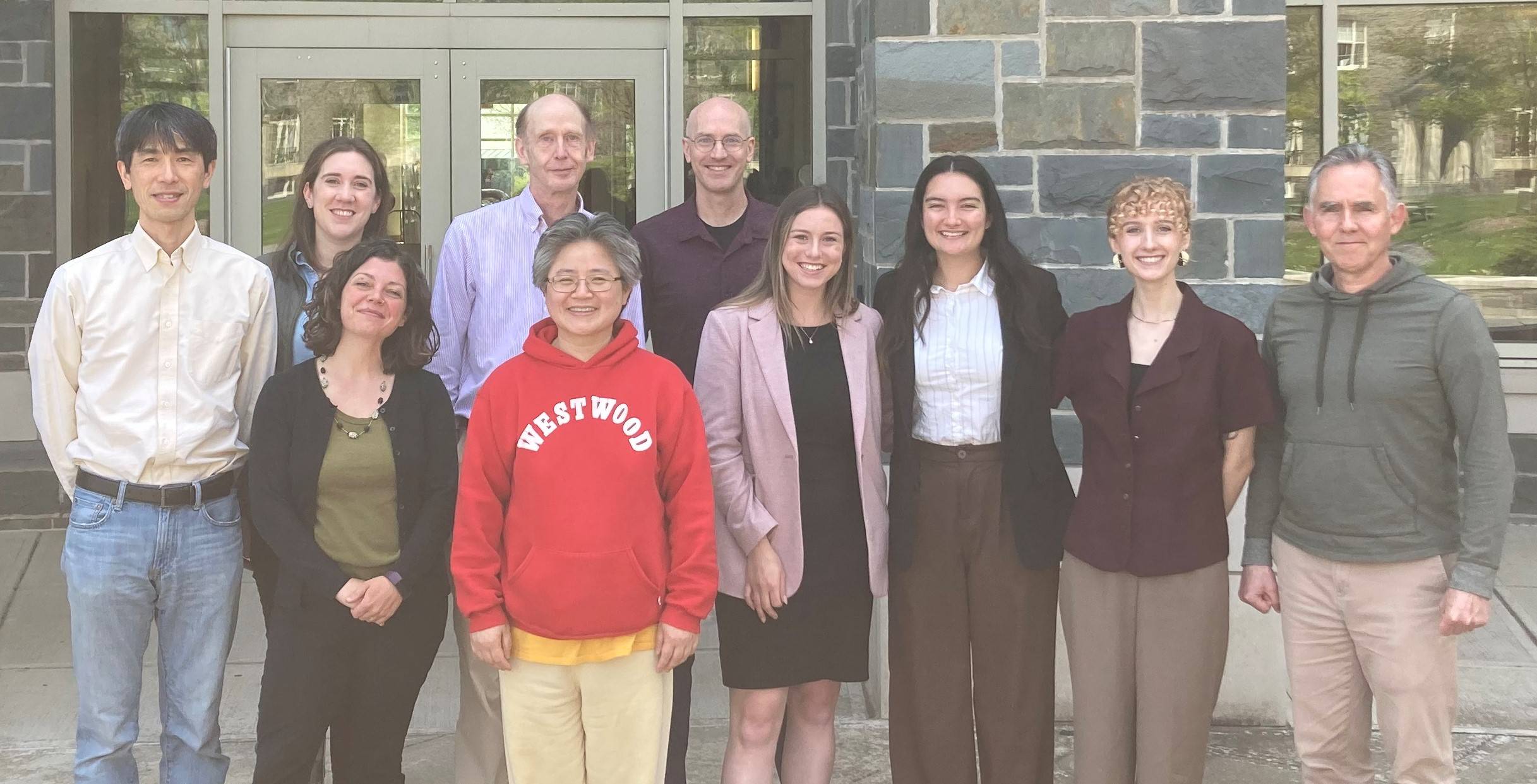 Geography faculty and staff with seniors presenting honors thesis.