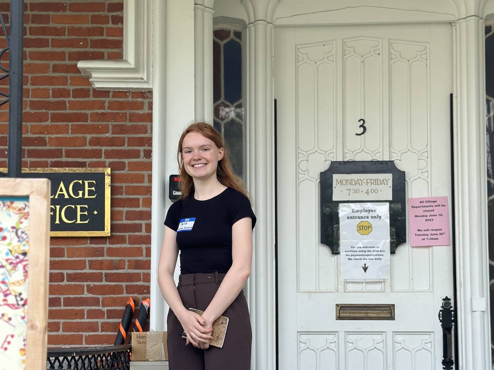 Tate Fonda ’25 in front of the village of Hamilton offices.