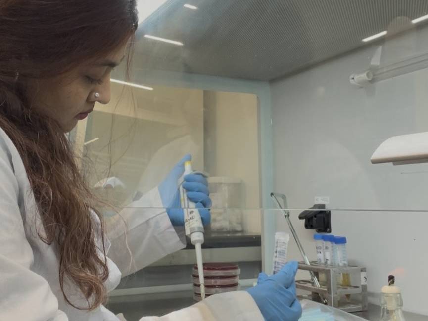 Ekra Hoque works in lab