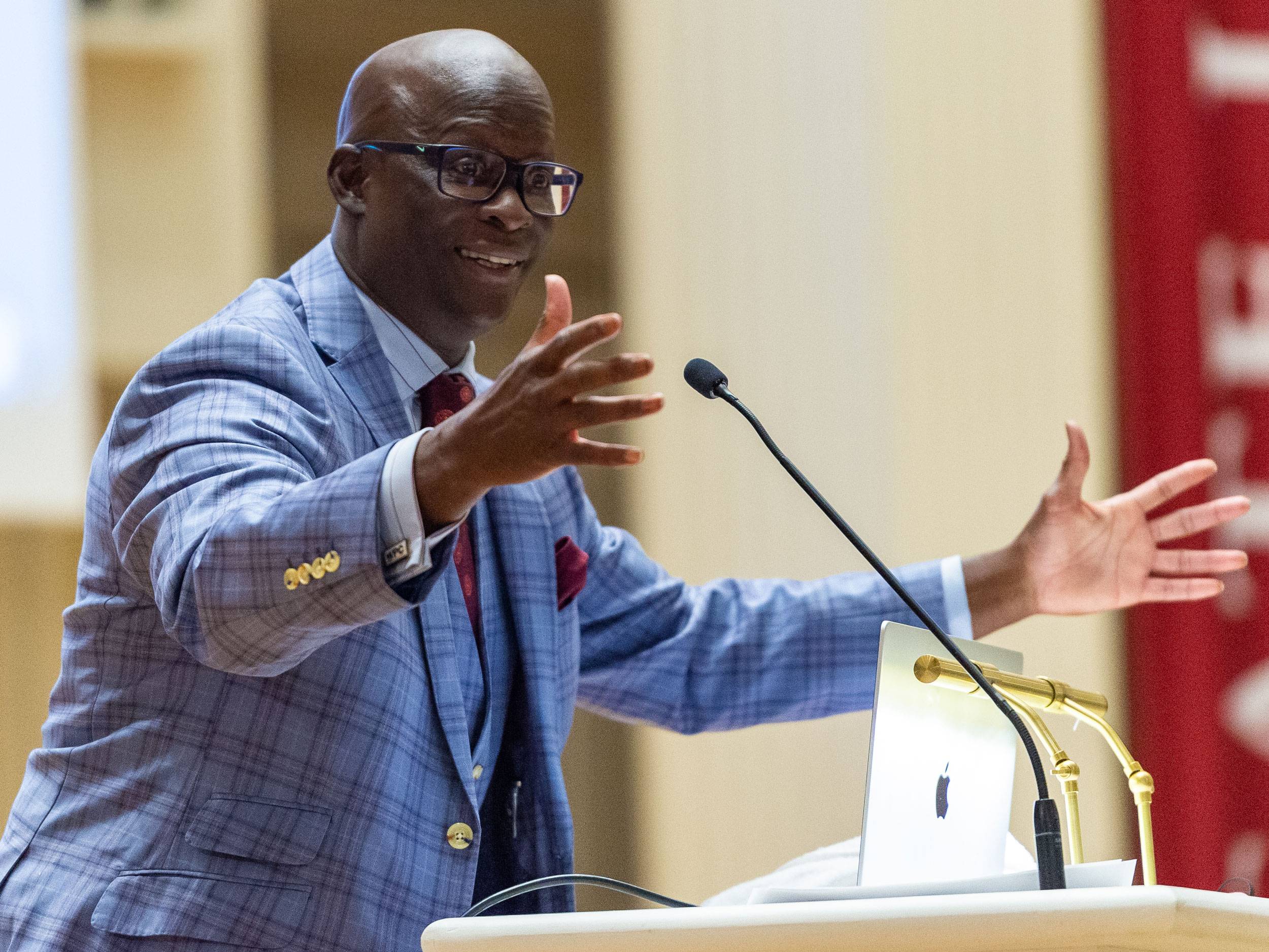 Dr. Eddie Moore Jr. speaks at podium