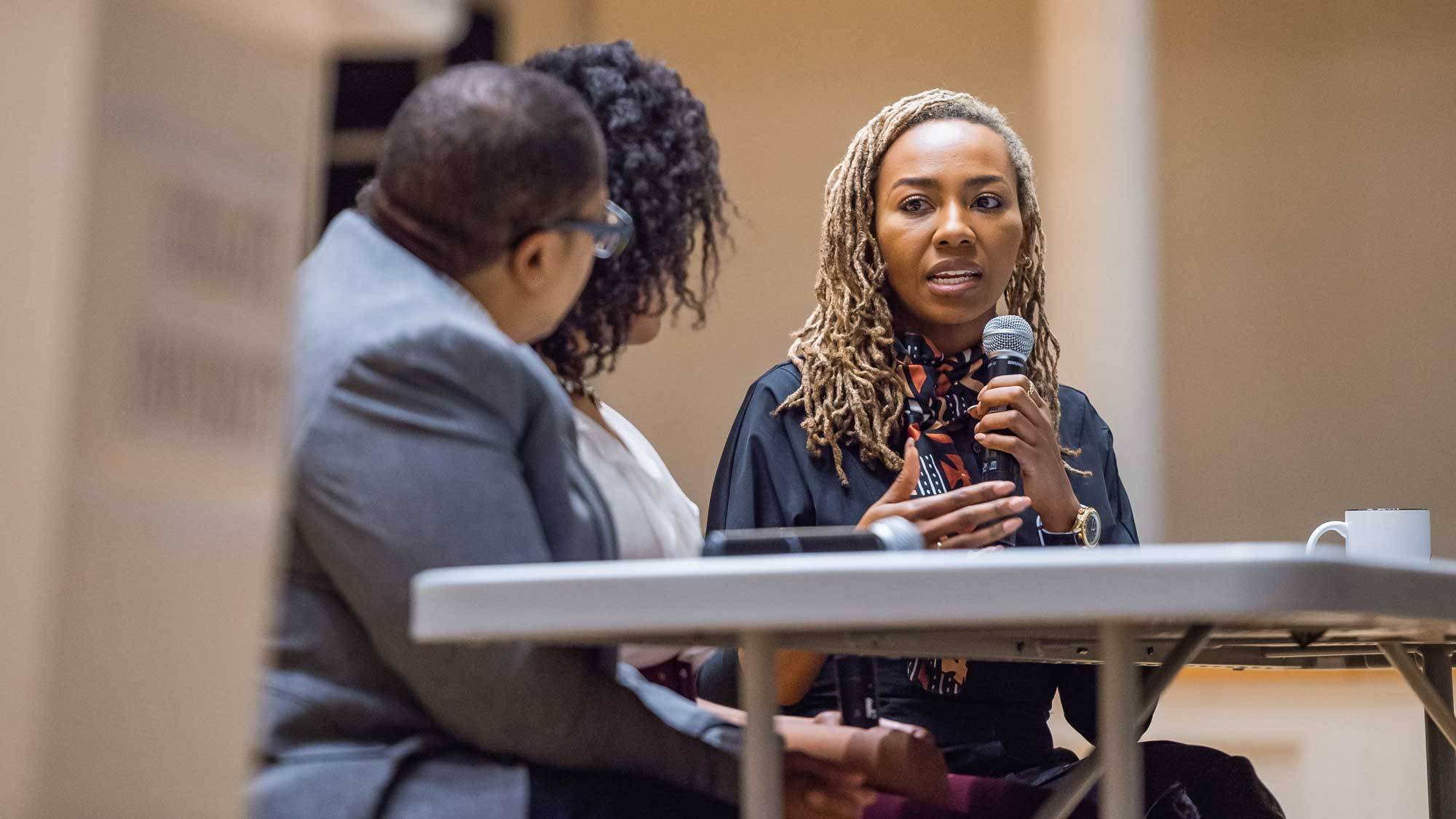 Opal Tometi speaks from Colgate University stage