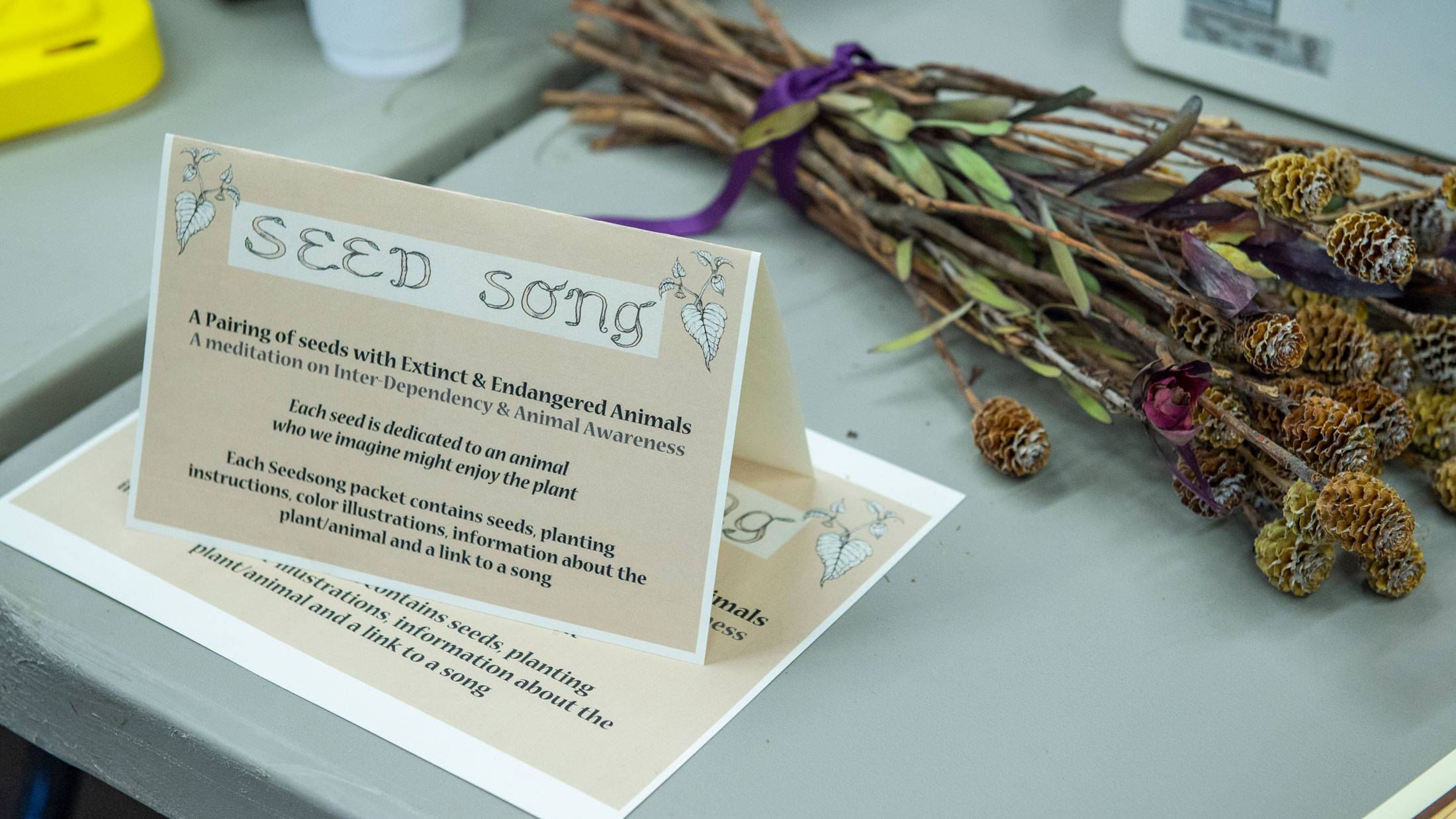 Poem on card and foliage on table