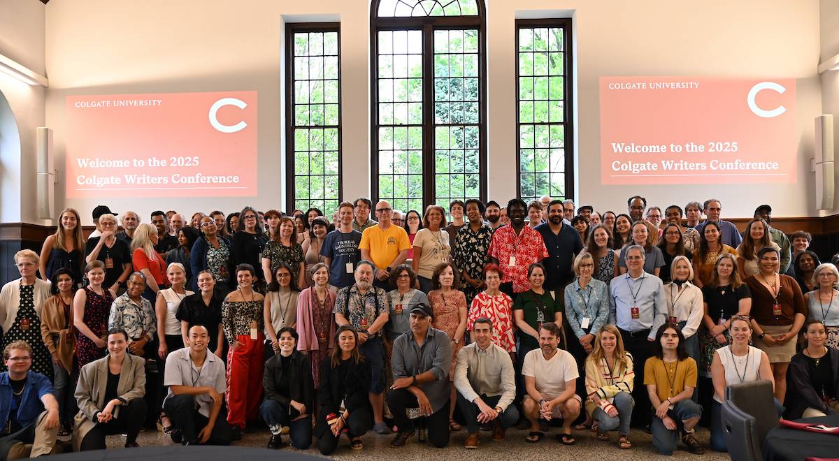 Group photo of 2025 Writers Conference participants in the Hall of Presidents