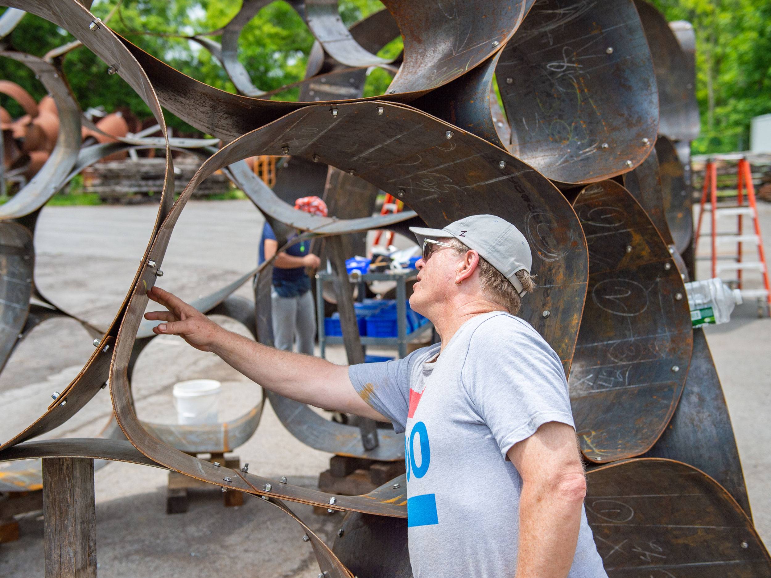 DeWitt Godfrey, Professor of Art & Art History, works on a sculpture