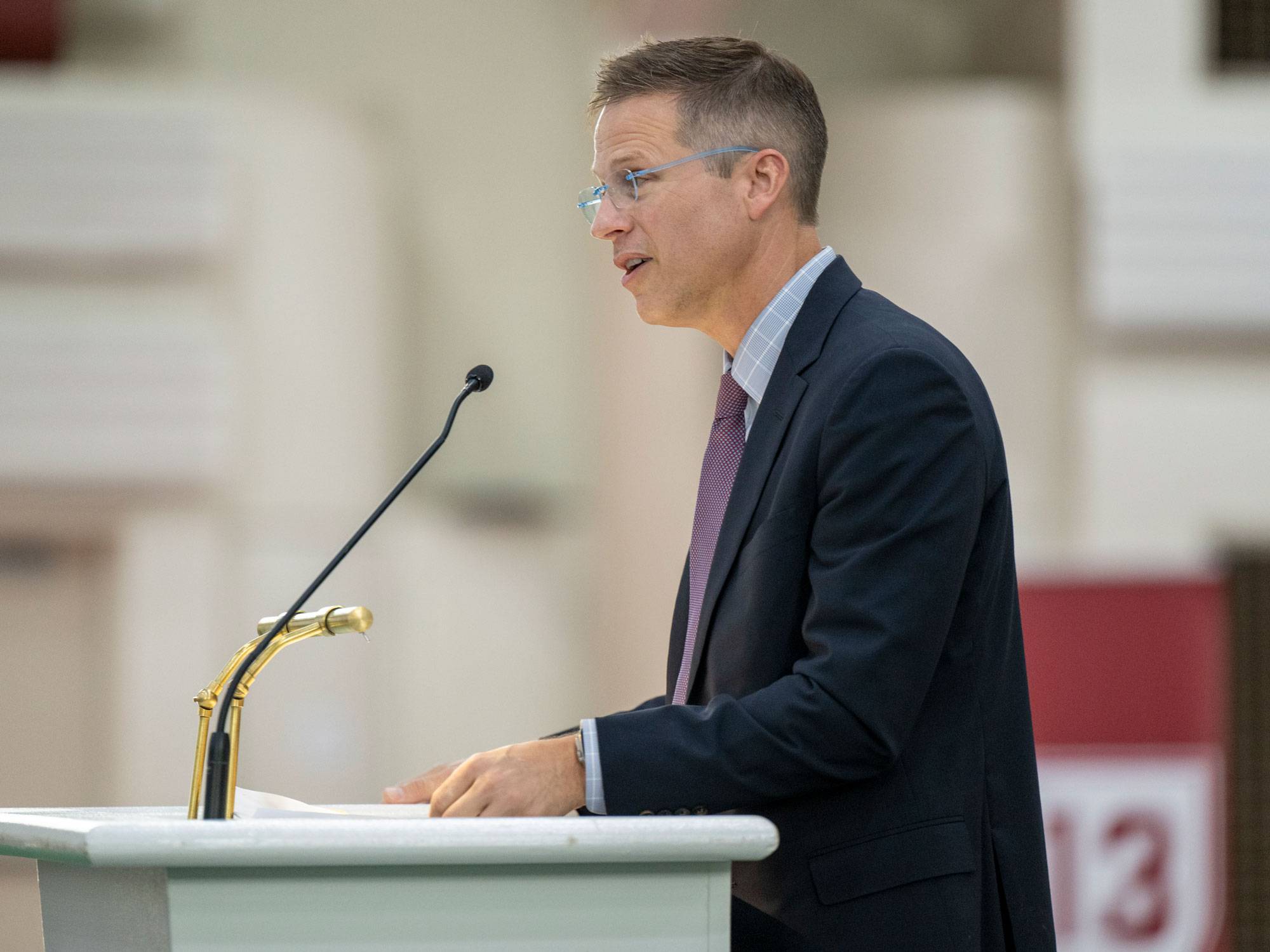 Dean of the College Paul McLoughlin stands at podium