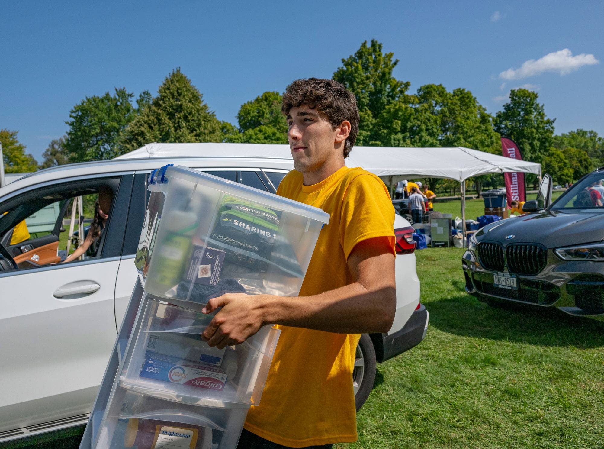 Student carries supplies on move-in day