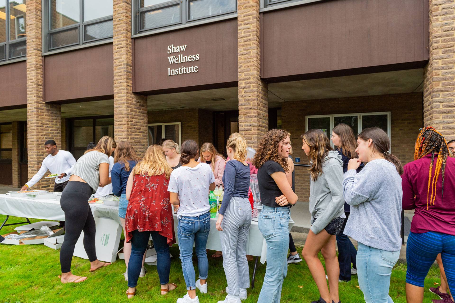 Students gather in front of the Shaw Wellness Institute