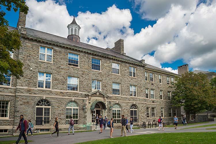 Students in walk between classes in front of Lawrence Hall