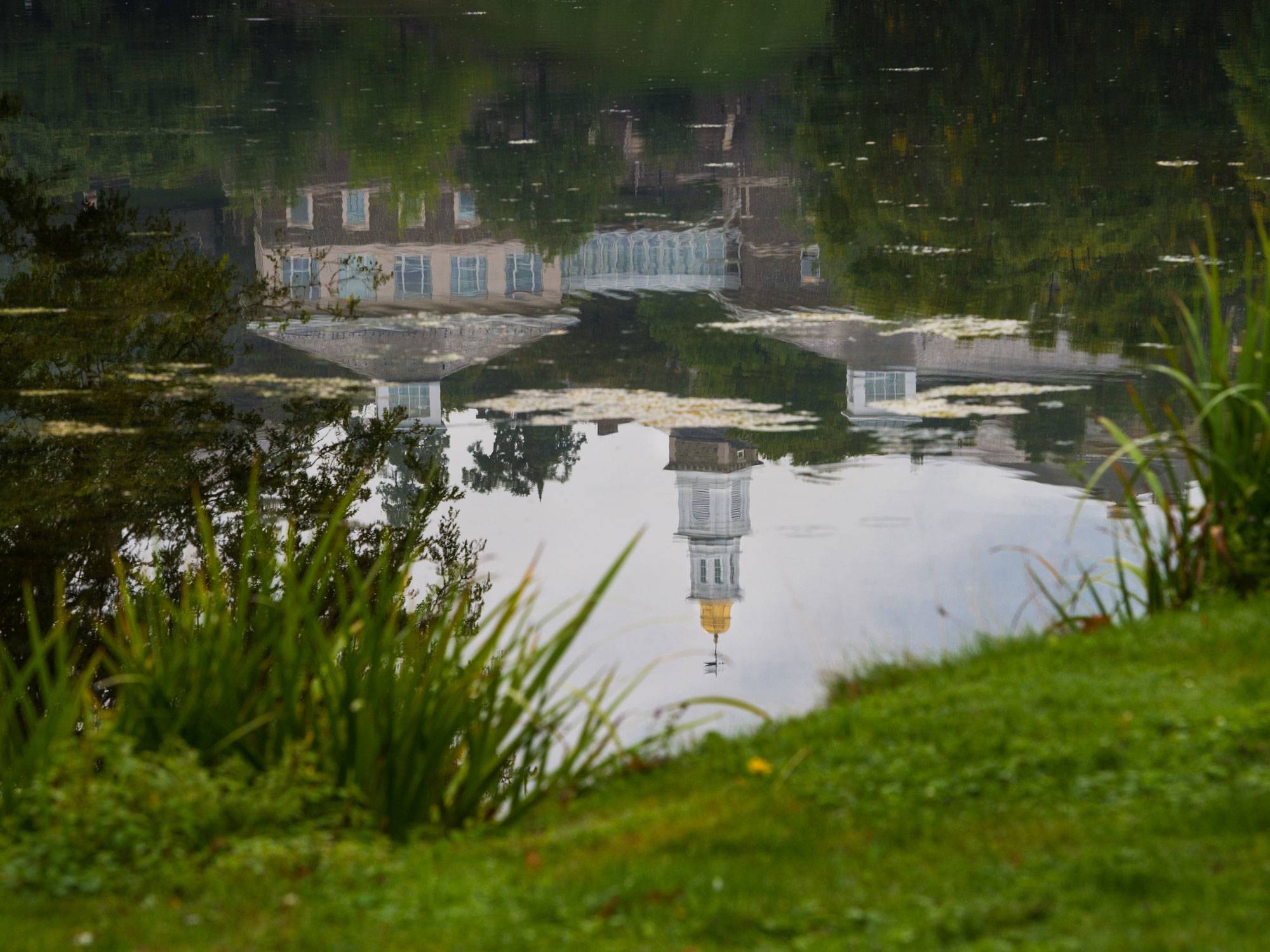 Chapel spire reflected in Taylor Lake