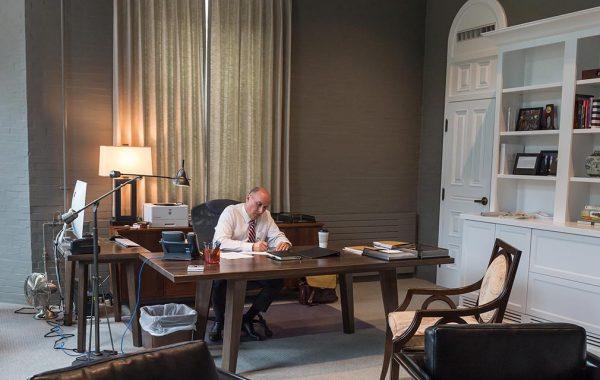 President Brian W. Casey works at the desk in his office