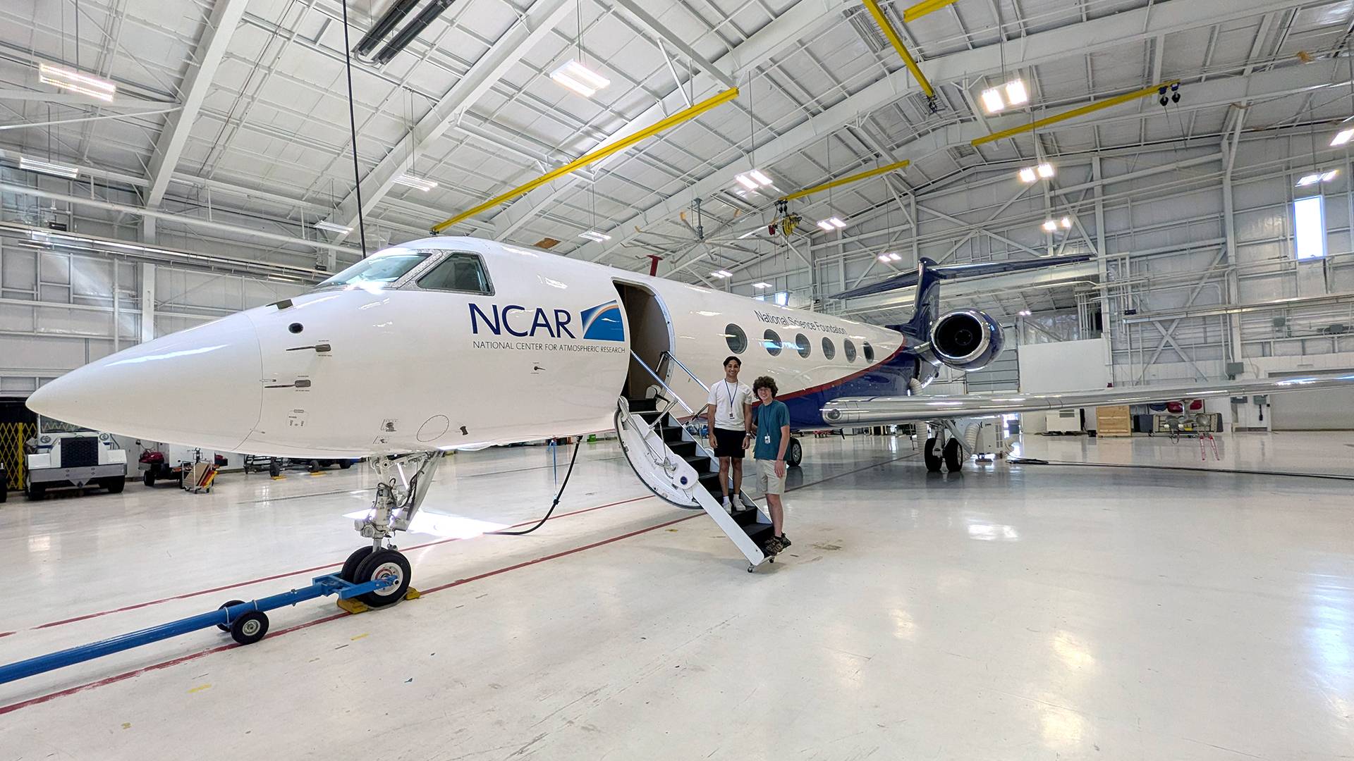 Dev and Gabe with the NCAR Gulfstream V research aircraft, which will sample high-altitude smoke plumes during the INSPYRE project