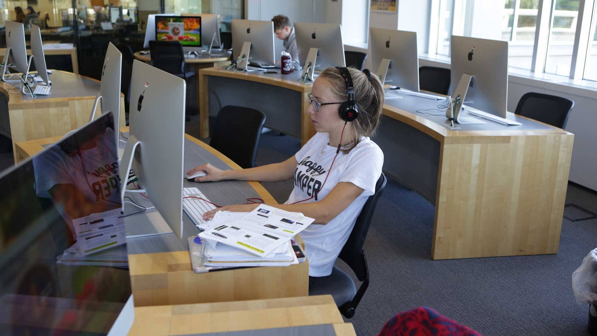 Student sits at library computer