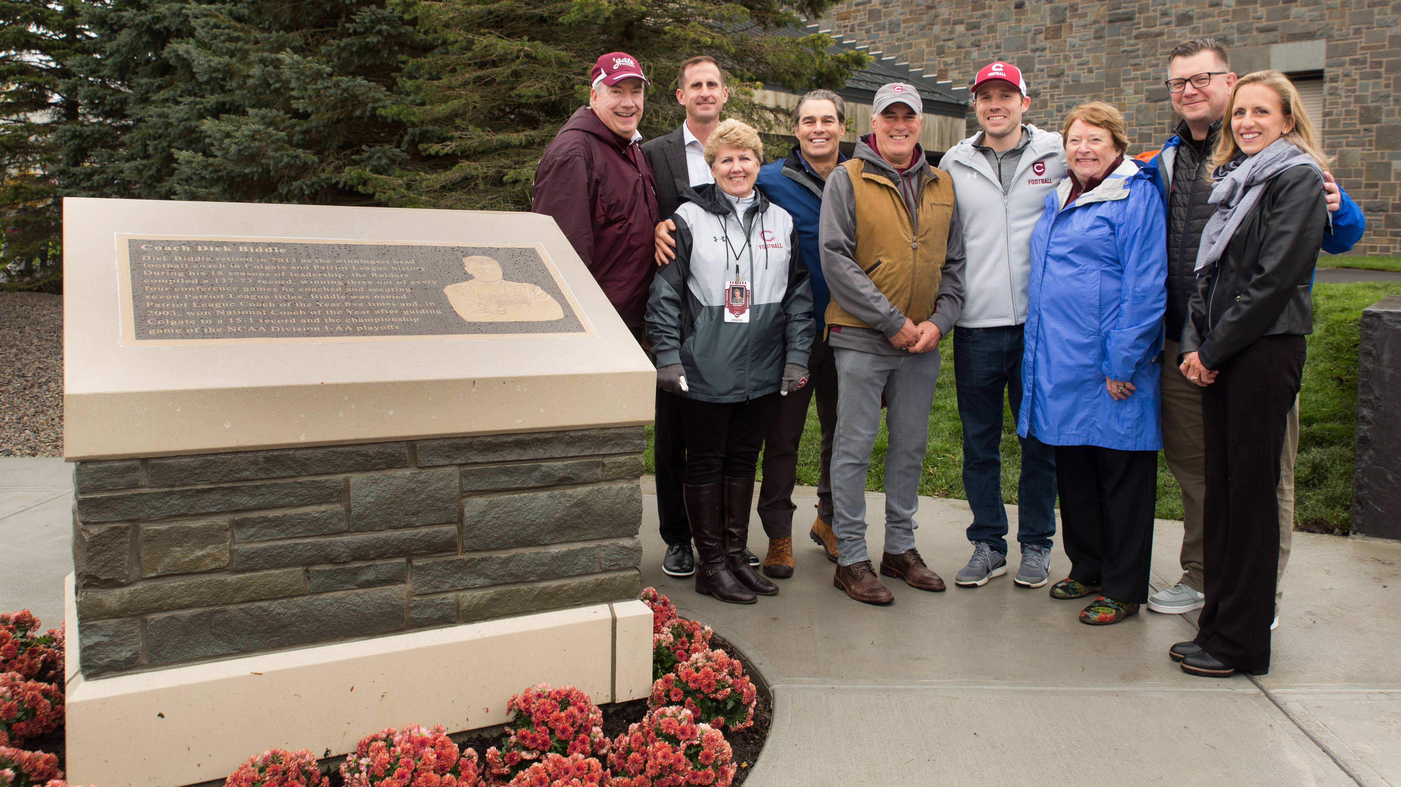 Alumni pose in front of new Biddle Monument