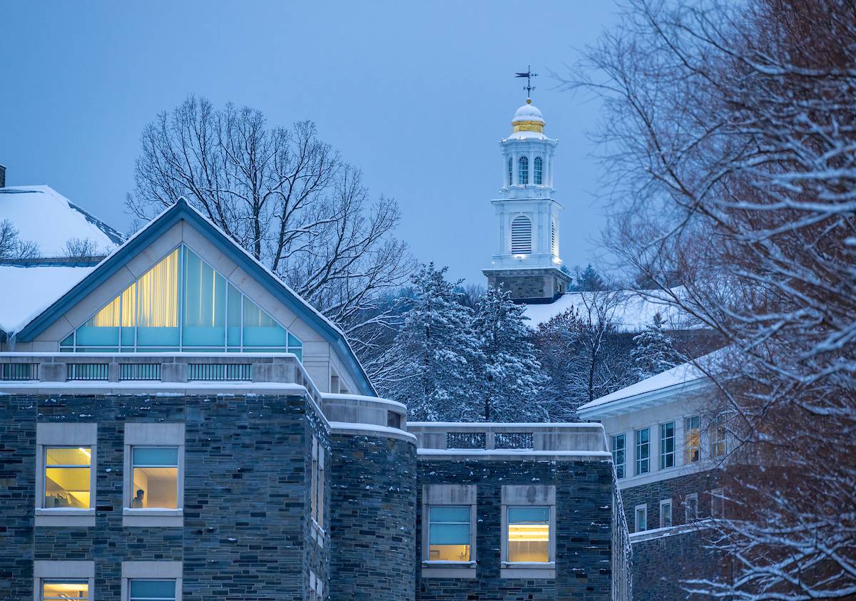 An image of Case library at dusk in the winter with the Chapel in the background. 