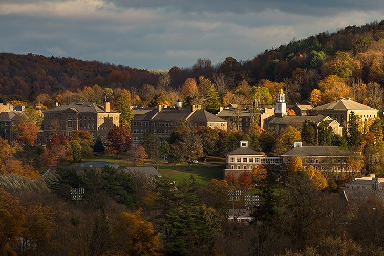 A scenic view of Colgate's campus and hillside from a distant with dramatic lighting