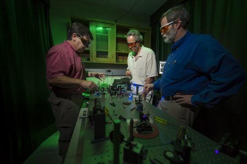 Enrique "Kiko" Galvez, Charles A. Dana Professor of Physics and Astronomy, conducts a quantum physics workshop for seven physics faculty from other colleges and universities. The workshop is about doing a new type of physics labs developed at Colgate that have acquired high visibility in the physics community.