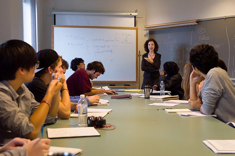 Valerie Morkevicius teaches at the front of a seminar room