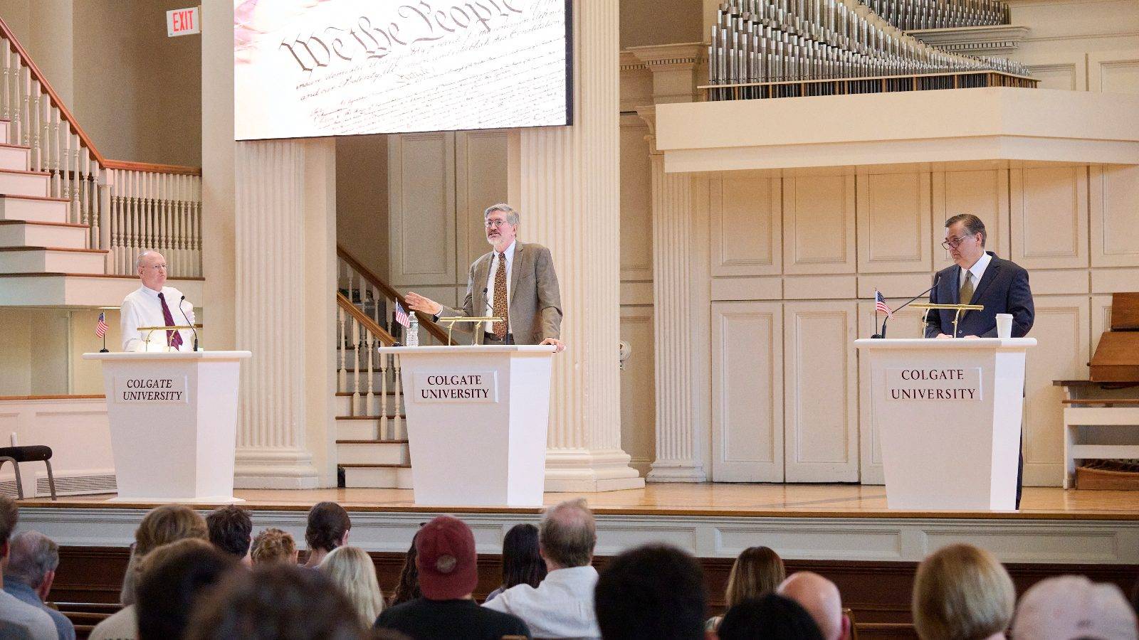 Jonathan Turley, the J.B. and Maurice C. Shapiro Professor of public interest law at George Washington University (right) and Michael Klarman, the Charles Warren Professor of legal history at Harvard Law School (center), took part in the 2025 Constitution Day Debate in Colgate Memorial Chapel Sept. 18. The debate was moderated by Stephen P. Garvey ’87, A. Robert Noll Professor of law at Cornell Law School (left).