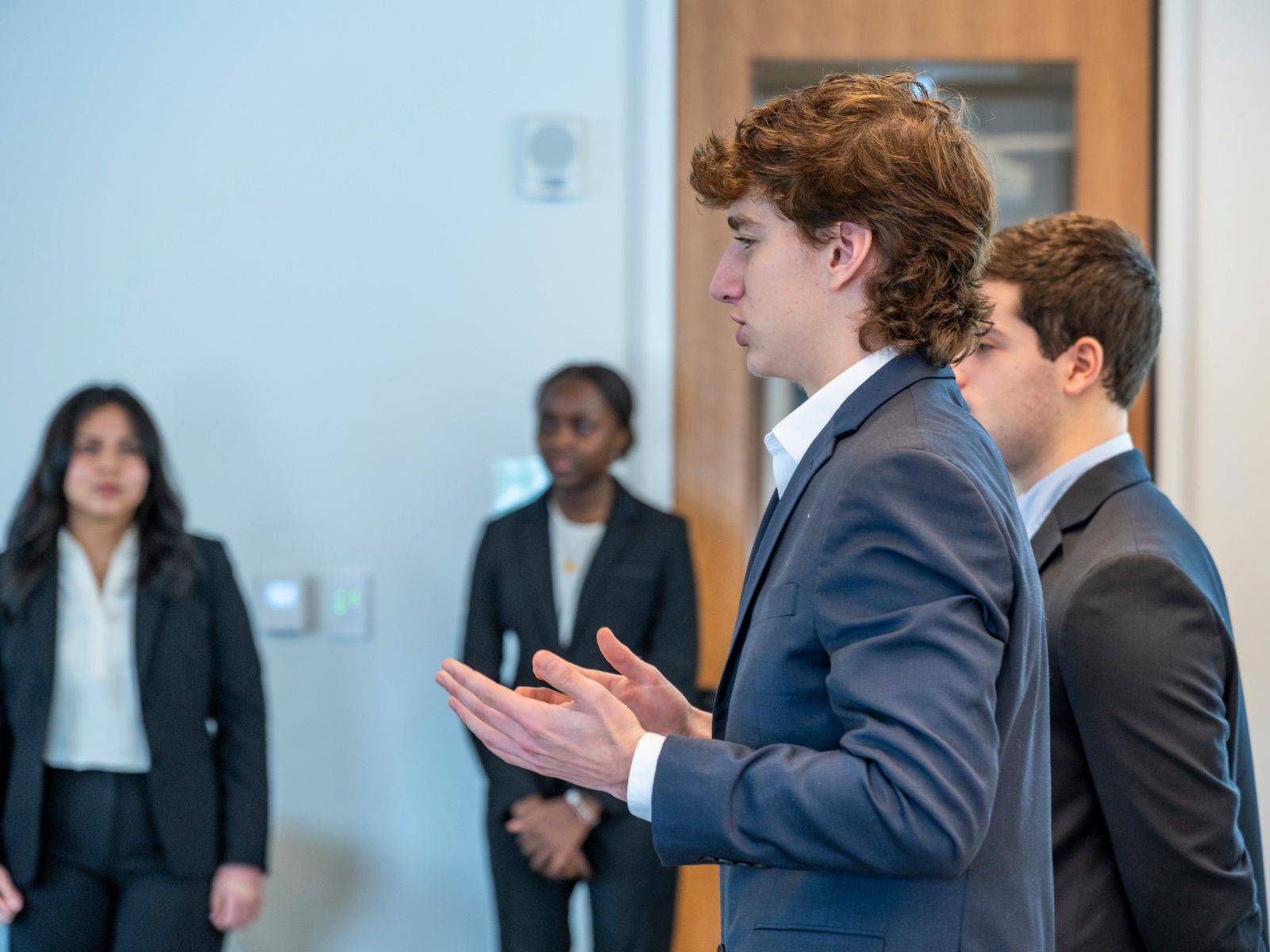 Ryan Wilson ’28 presents his capstone project on American Airlines during the Tuck Bridge Business Program at Colgate Jan. 16.