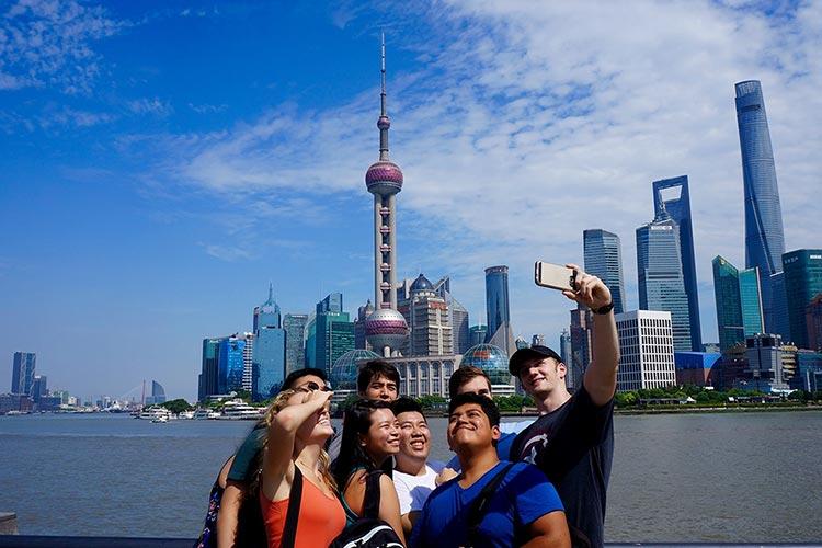 Colgate students take selfie in front of Beijing skyline
