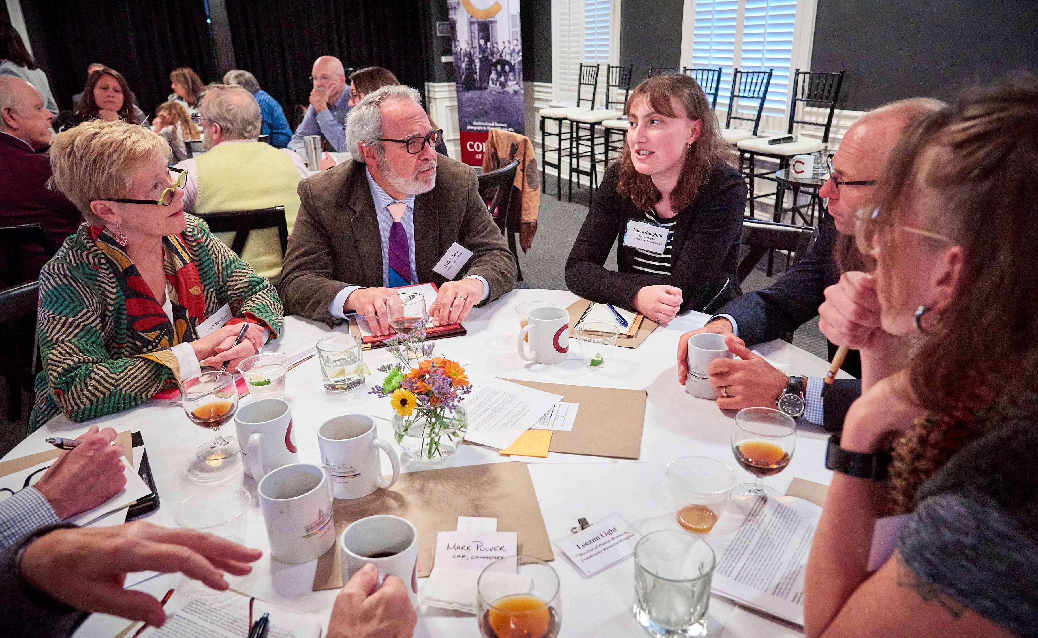 Participants at the 4C conference discuss economic development ideas on Oct. 25.